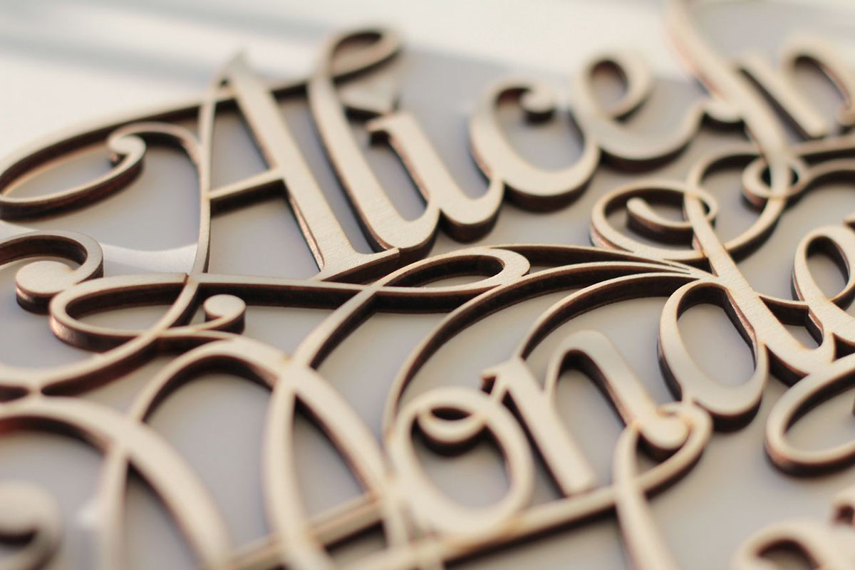 alice wonderland type lettering callygraphy ligature wood laser cut Volume