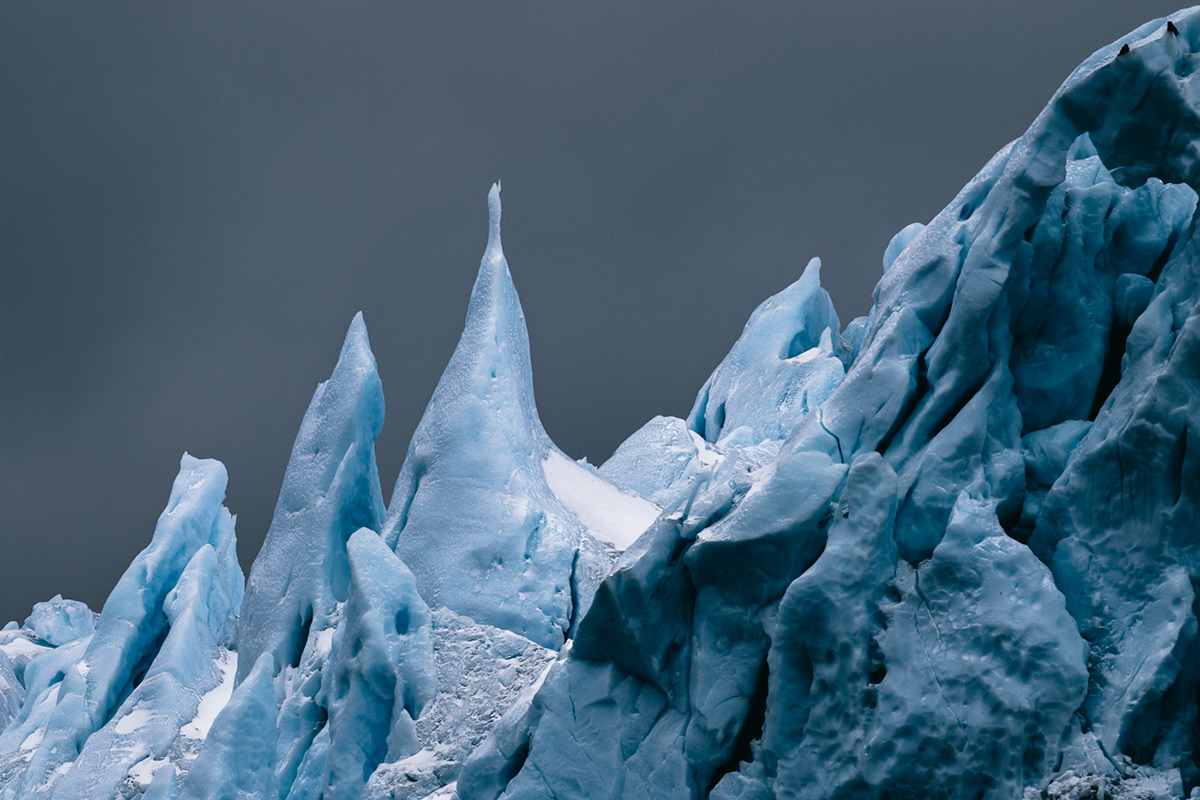 Greenland winter Arctic ice glacier iceberg global warming dark clouds frozen