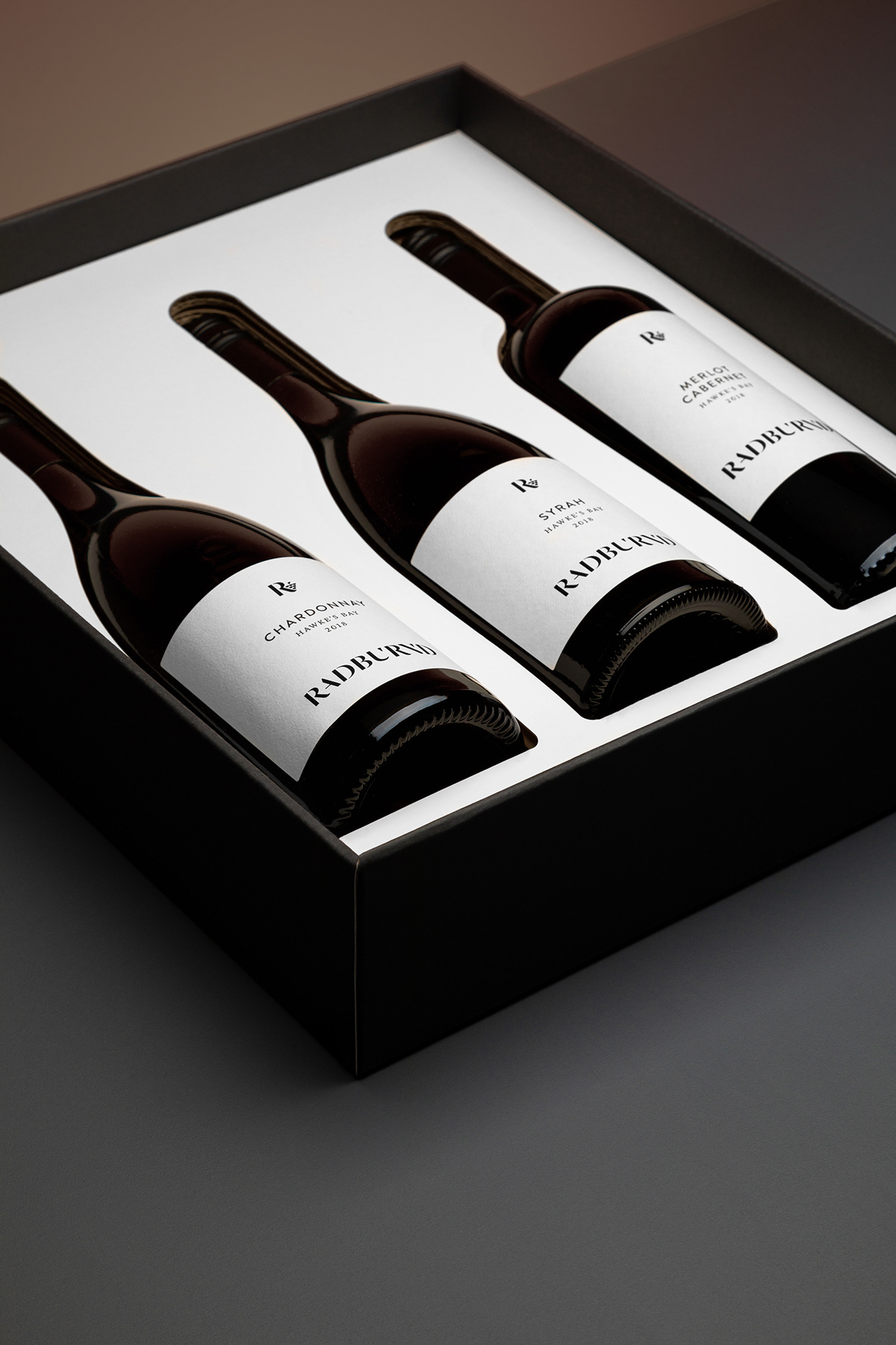 three bottles of wine in a bespoke packaging design