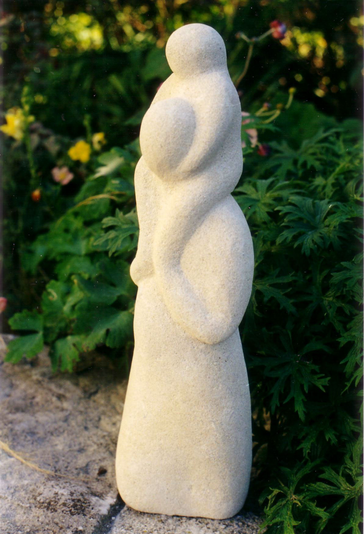 sculpture woman figure child children parent Carry family stone