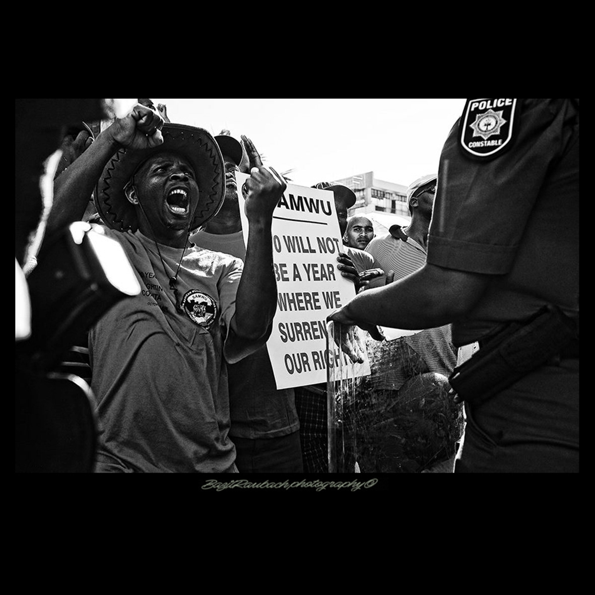 black and white monochrome photojournalism  political unrest protests rioting riots south africa street photography unnecessary violance
