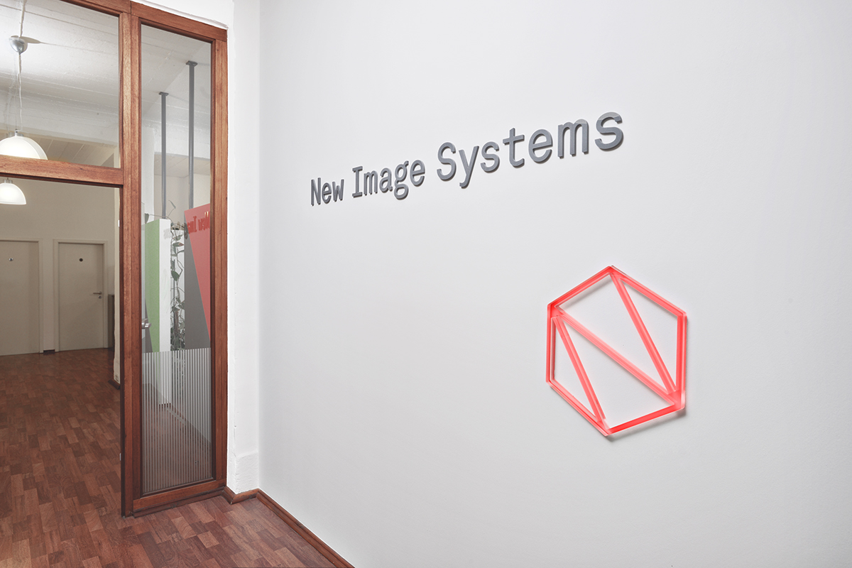 interactive wall sign illuminated logo server system multicolor Internet of Things hexagon IT