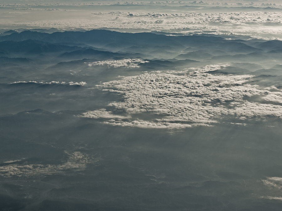 from above Landscape Nature contemporary fine art on the fly sea Ocean clouds billows structure texture documentation art aerial view top down drifting clouds wideness 10.000m above aerial photographs air water cumulus the world photographs china asia Jakob Wagner Sun sunlight sun-drenched light bright medium format
