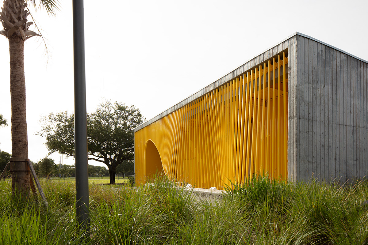 Adobe Portfolio concrete park pavilion curved concrete roof sports pavilion yellow park building