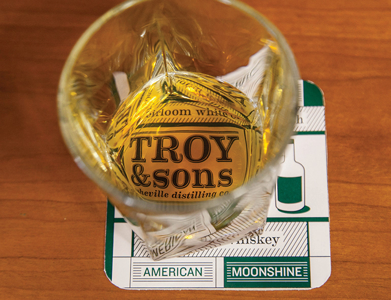 Troy and Sons distillery Whiskey Asheville north carolina craft distilling logo Label brand farm to bottle limited production whiskey Moonshine Barrel Aged Quality family business