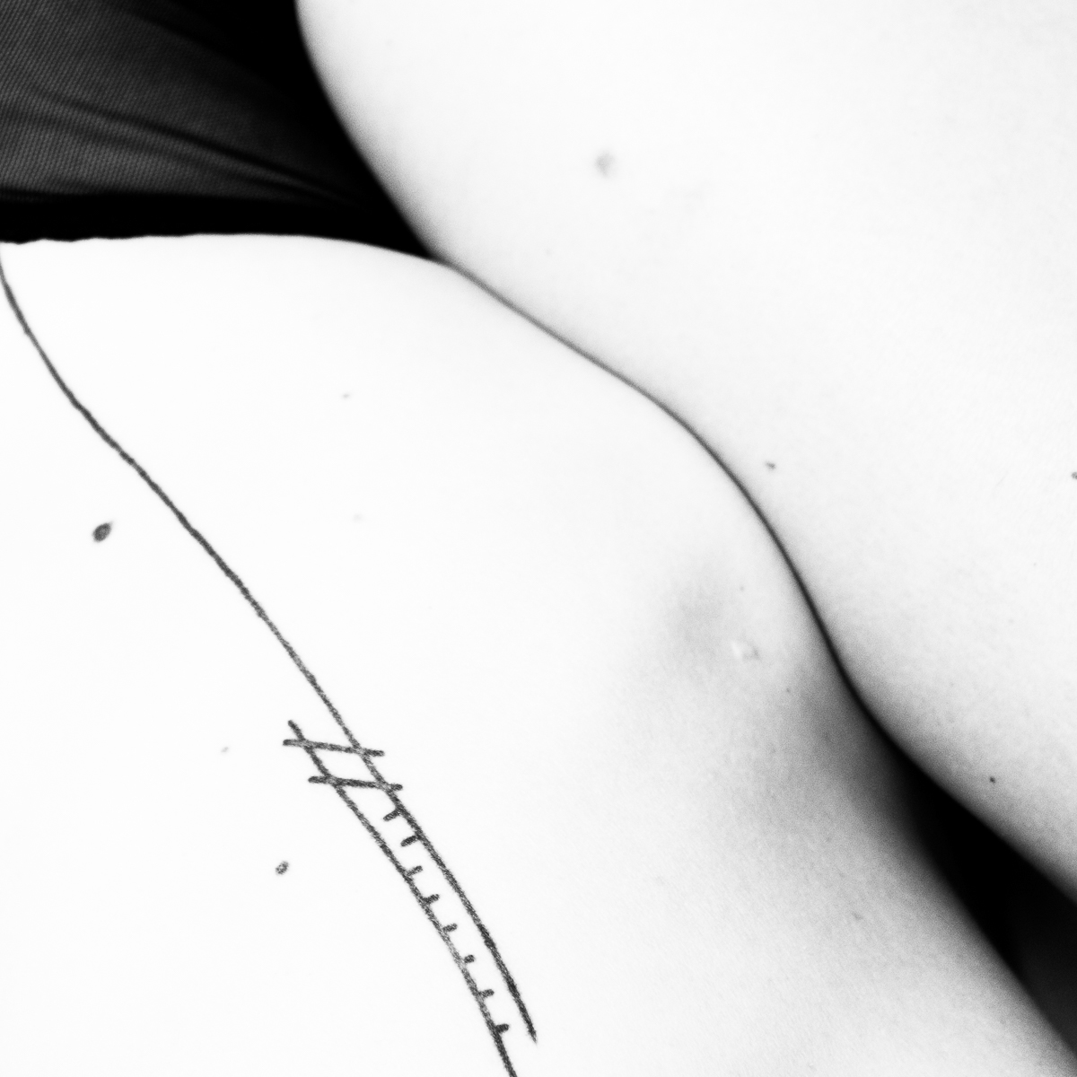 black & white nude boudoir lines tattoo blonde model portrait skin body