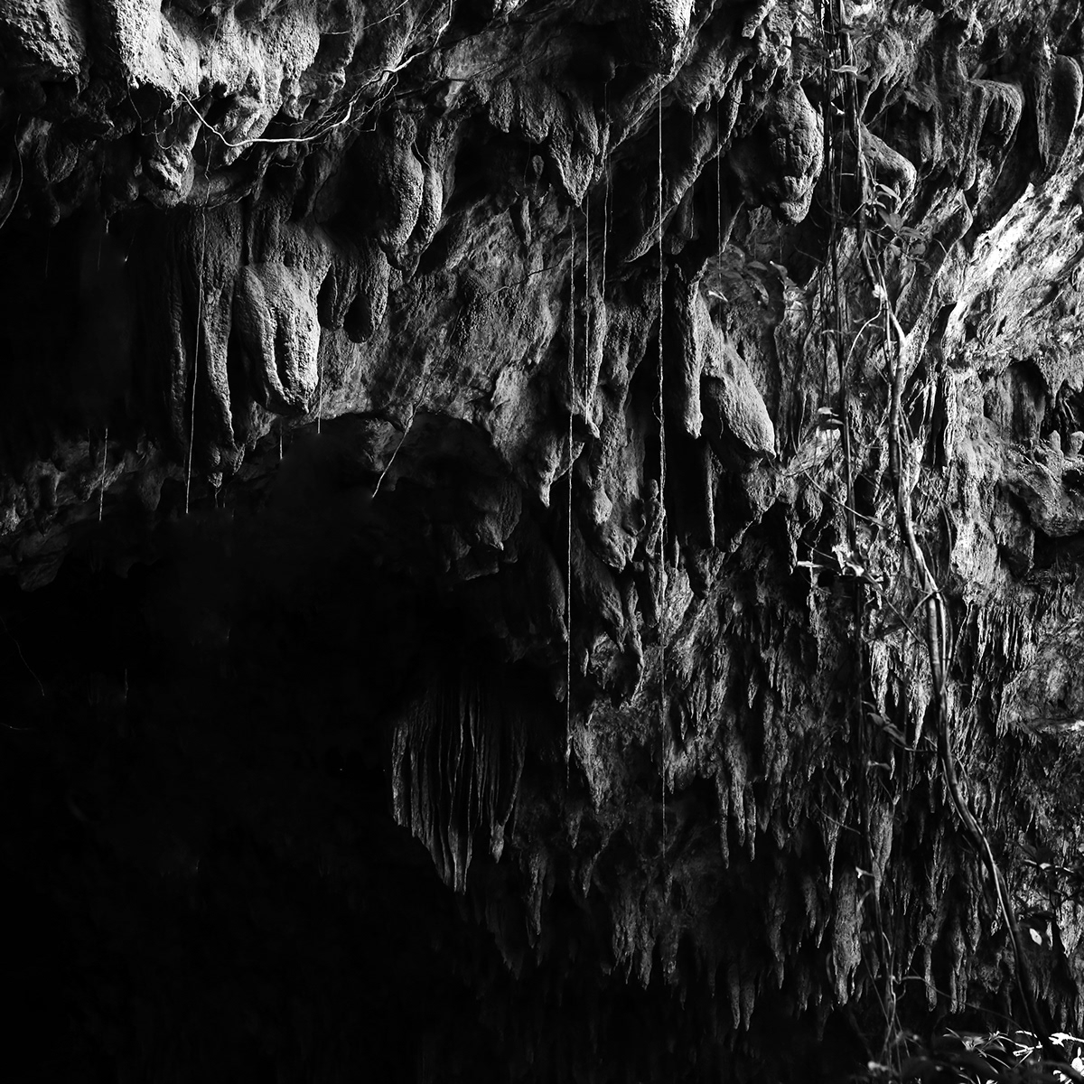 Image may contain: cave, black and white and nature