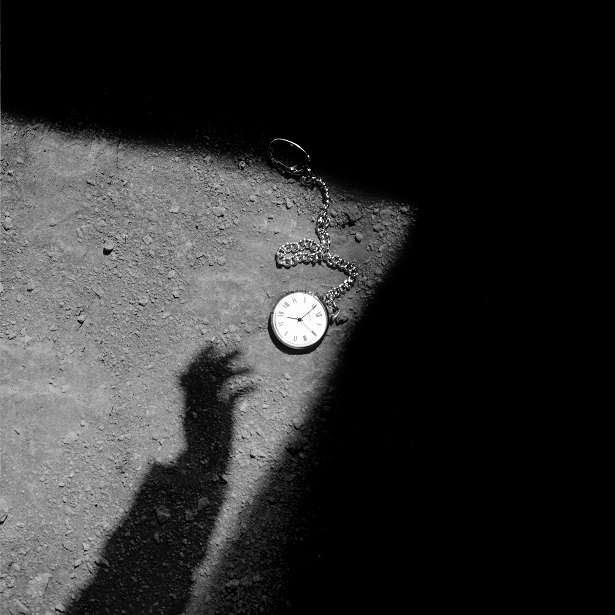 black and white geometry shadow hands clock reality