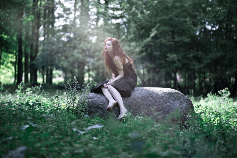 model photo-shoot forest green woman siren nettles stone Sun ray of light setting sun melancholia Sadness longing