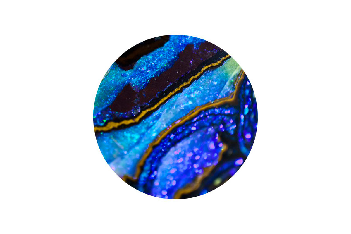 close up macro mineral opal silica mineraliod gemstone rainbow gem fire red blue green limestone