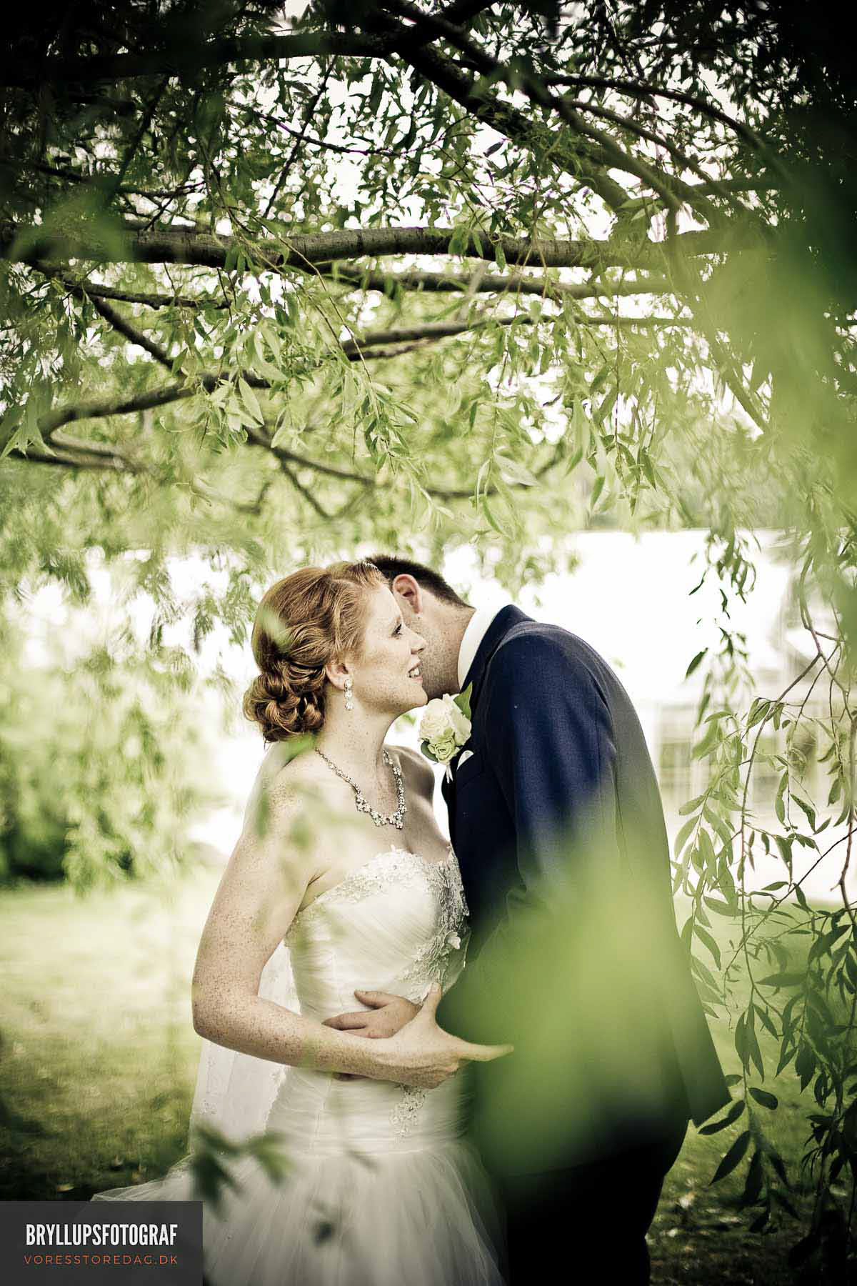 Image may contain: kiss, tree and bride