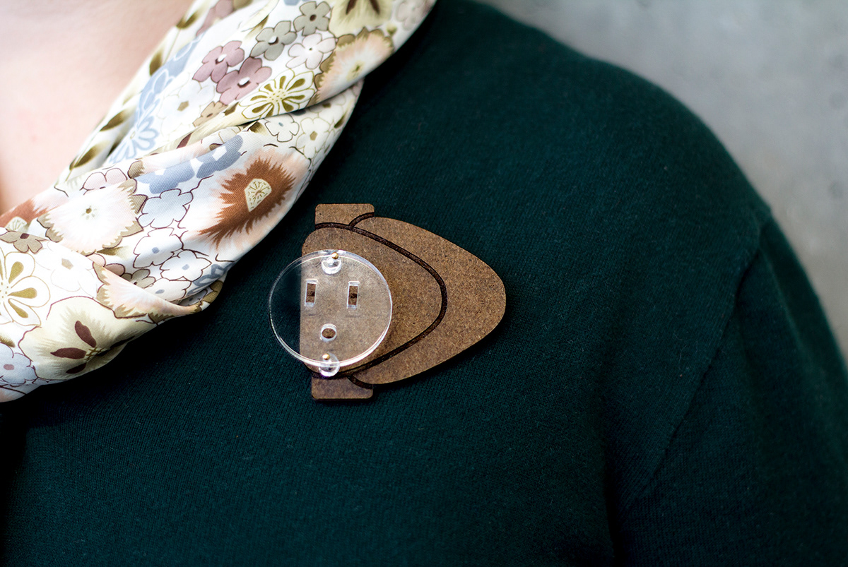 brooch conceptual brooch collaboration icon Icon postgeography wearable icon wearable friendship home friend collaboration plugs outlets adaptivity international plug laser cut masonite