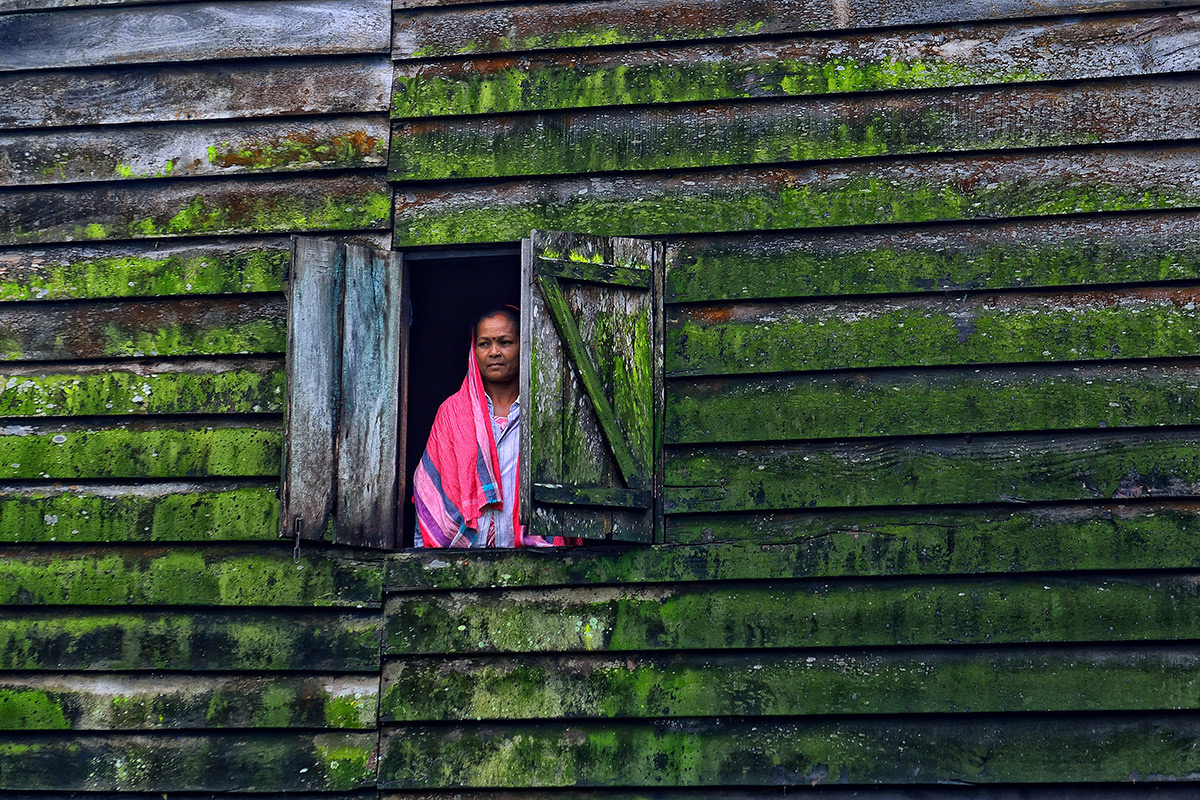 Woman in her home in a forest village