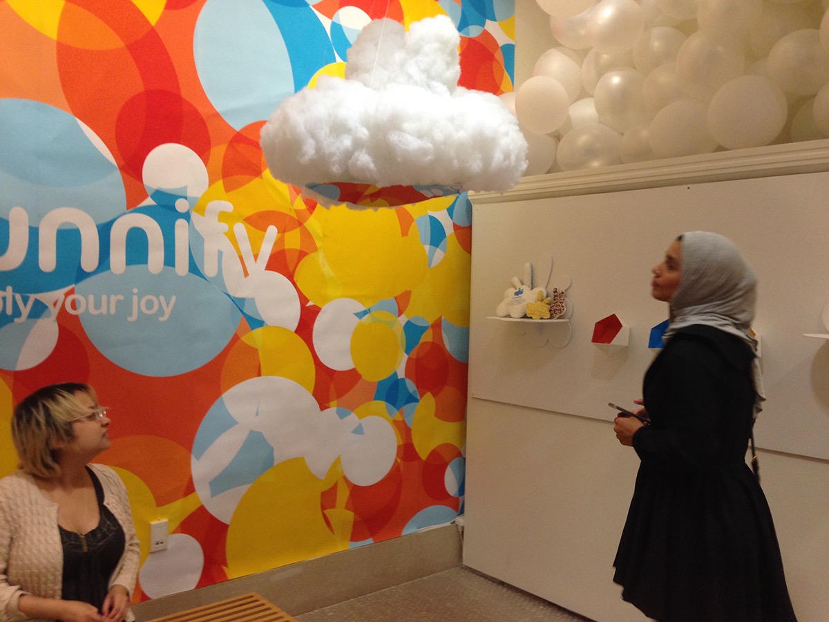 installation bunnify multiply your joy happiness colorful clouds big book