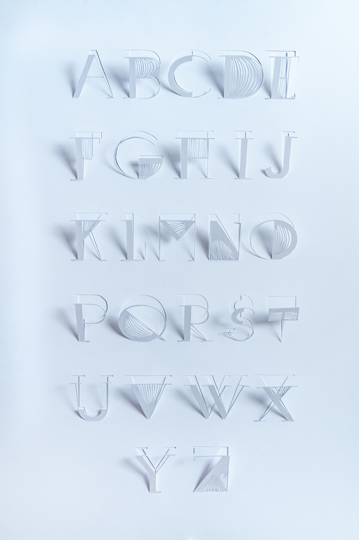 Paper cutting alphabet three dimensional pop-up