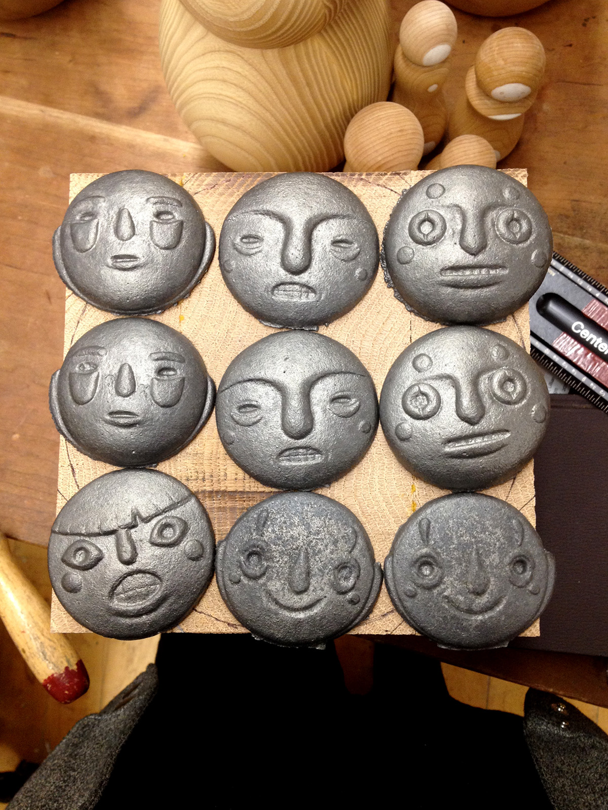 kokeshi dolls table top wood mask faces risd Cast Iron