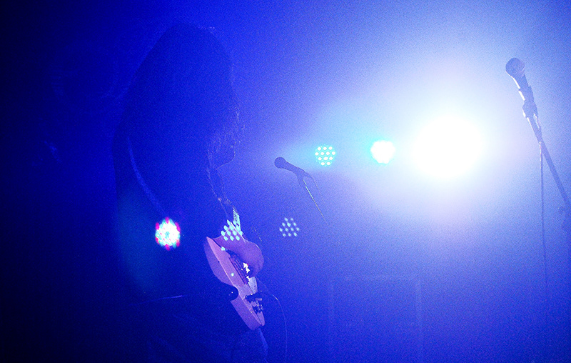 band vocalist guitarist bassist lights Stage