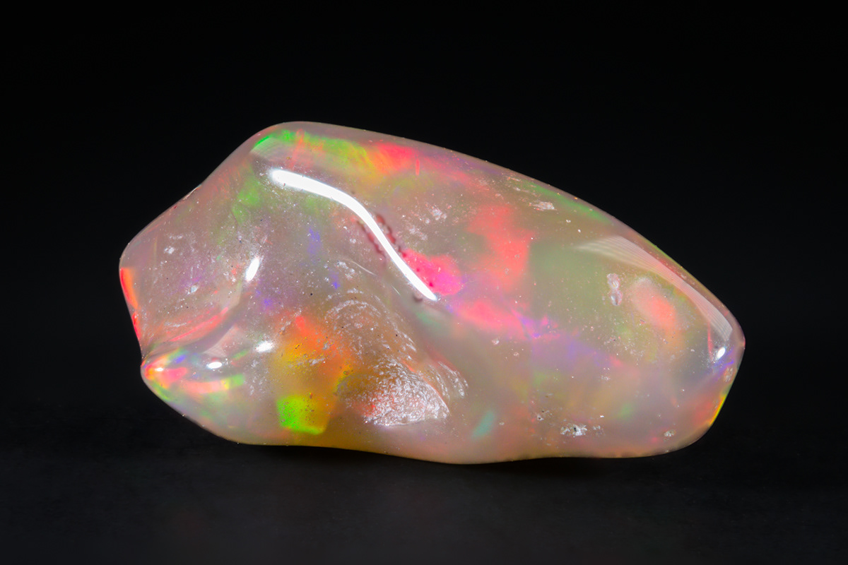 Nice little polished opal chip from Ethiopia, showing great play of color.