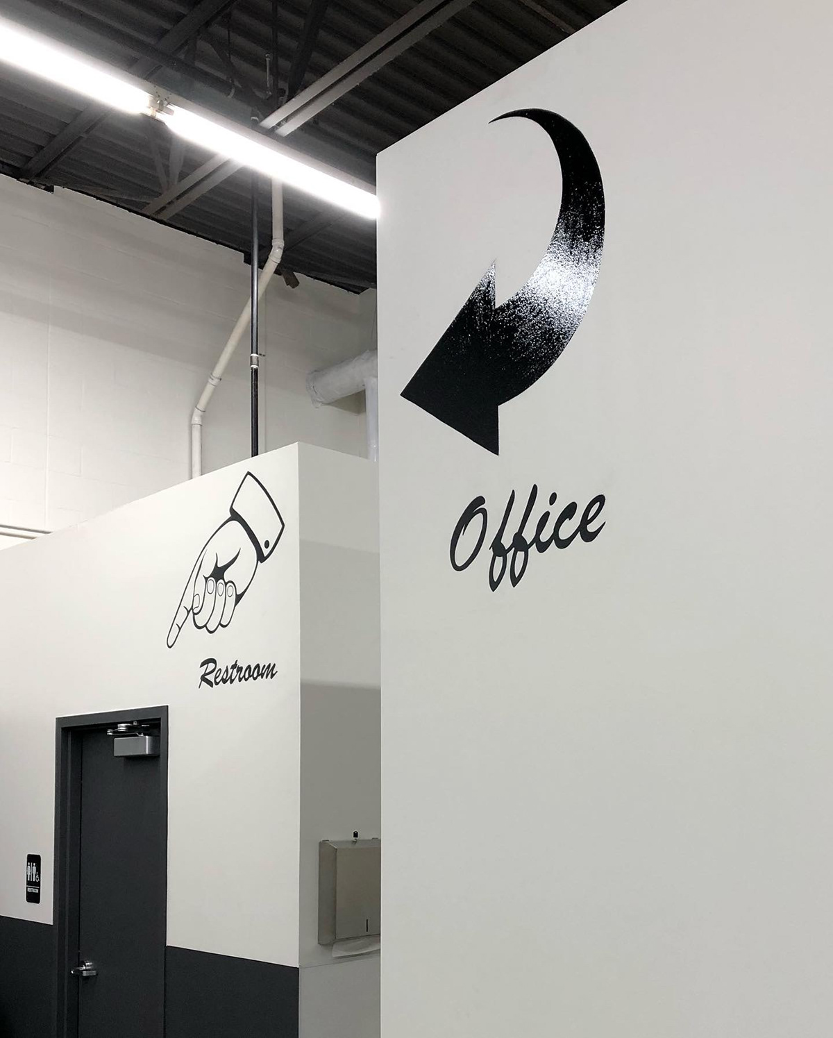 Hand painted signs on office walls.