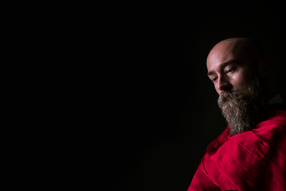 Chiaroscuro beard red fabric portrait