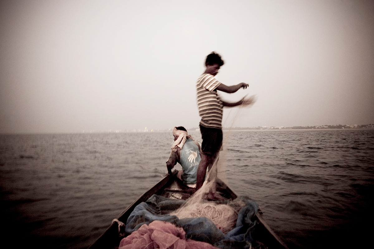 Puri India fishing village Coast beach fishermen children water Ocean Boats shrimp fishing