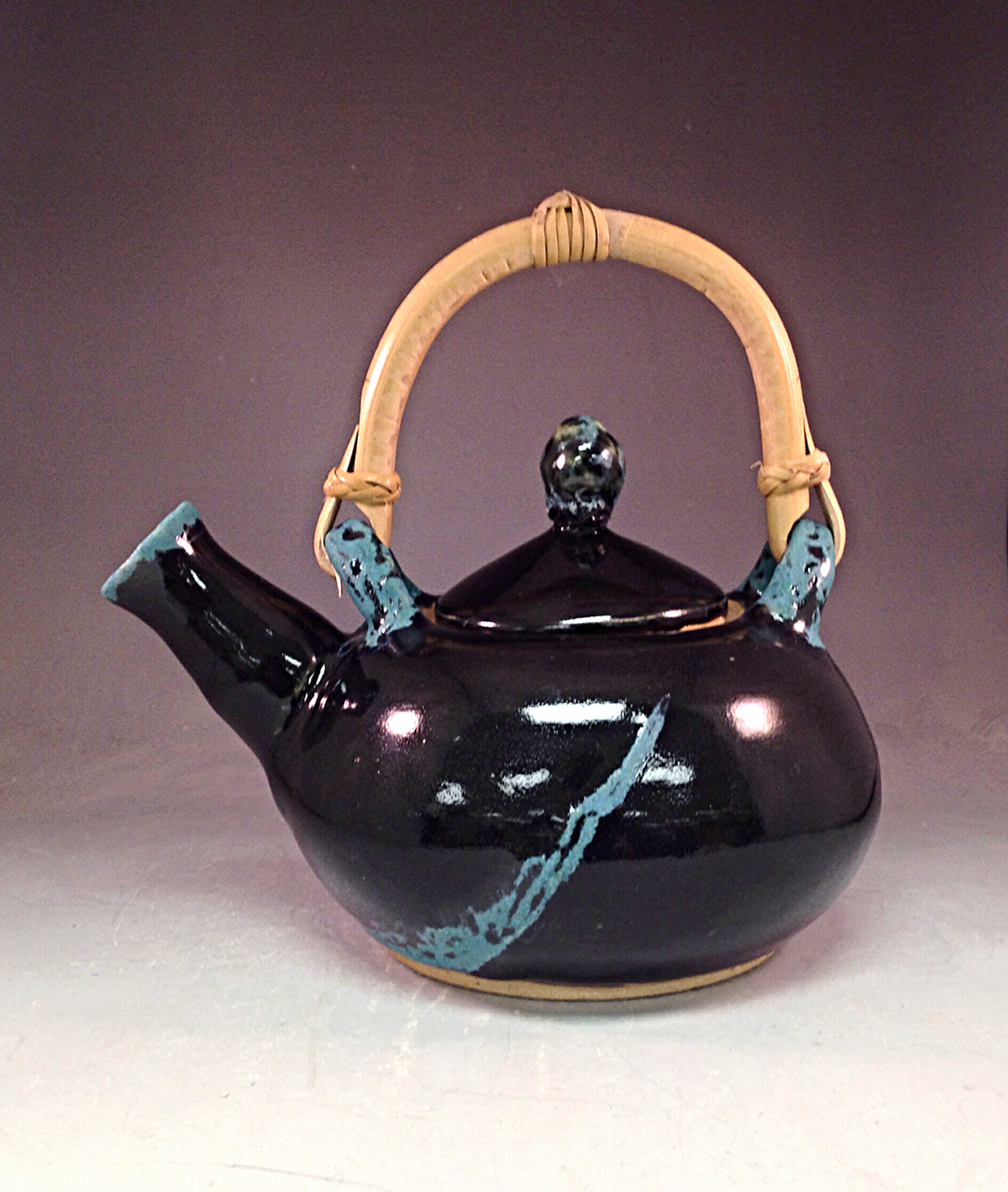 Pottery wheelthrowing teapot
