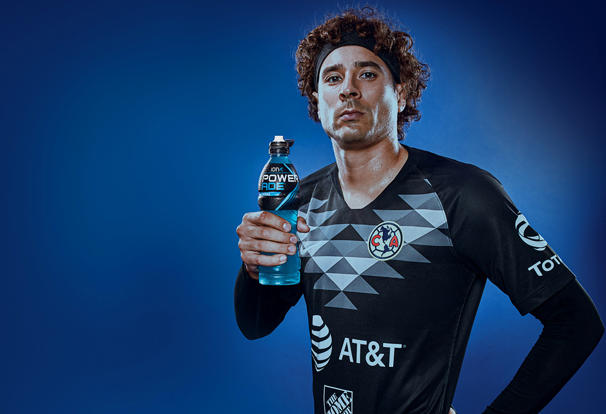Portrait of Memo Ochoa, Mexico's goal keeper stand with a bottle of Powerade in his hand
