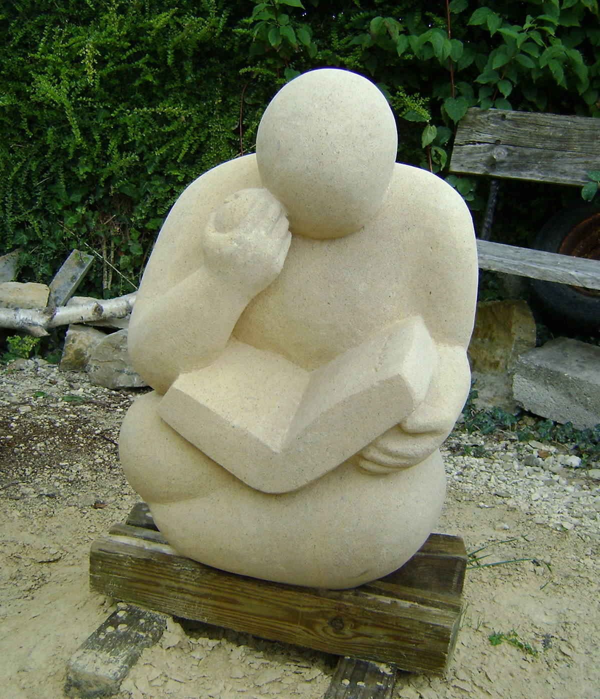 sculpture stone figure human Form book Reading relaxing carving Dorset UK female