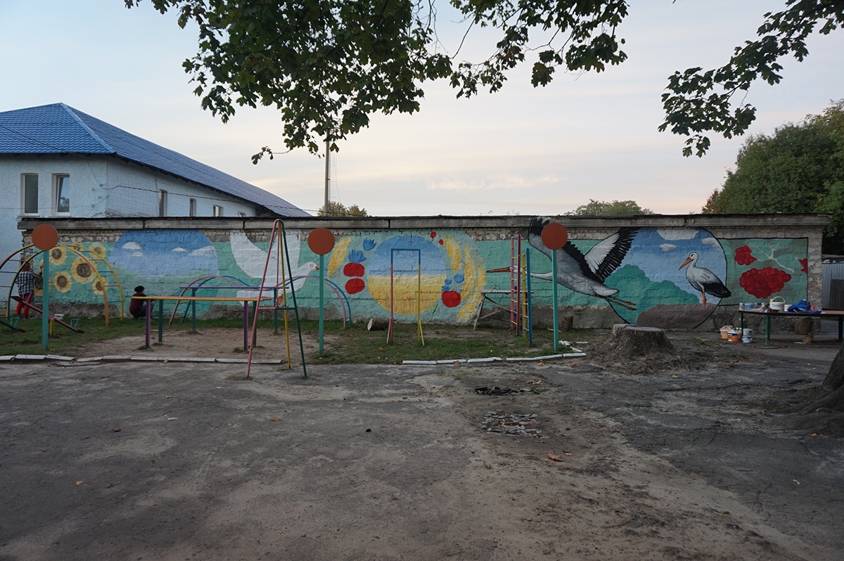 Storks dove children school ukraine wall