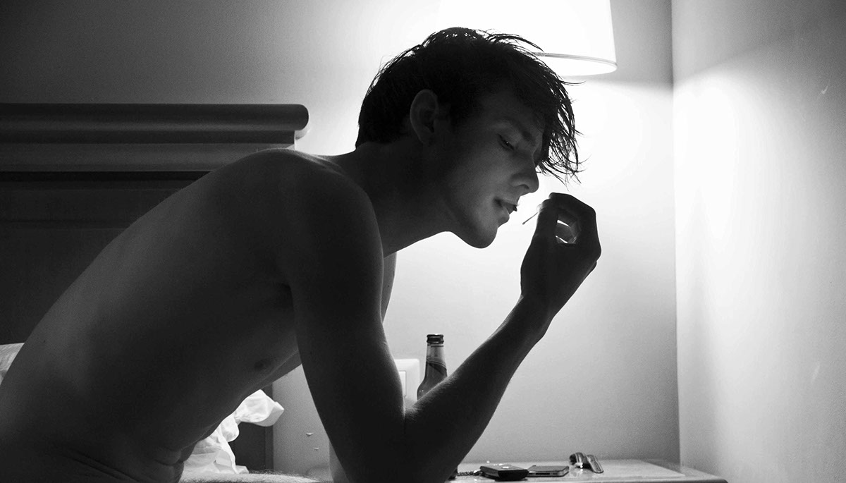 model dustinphil blackandwhite greyscale hotelroom bed sheets light boy tattoo wolf cigarette smoke