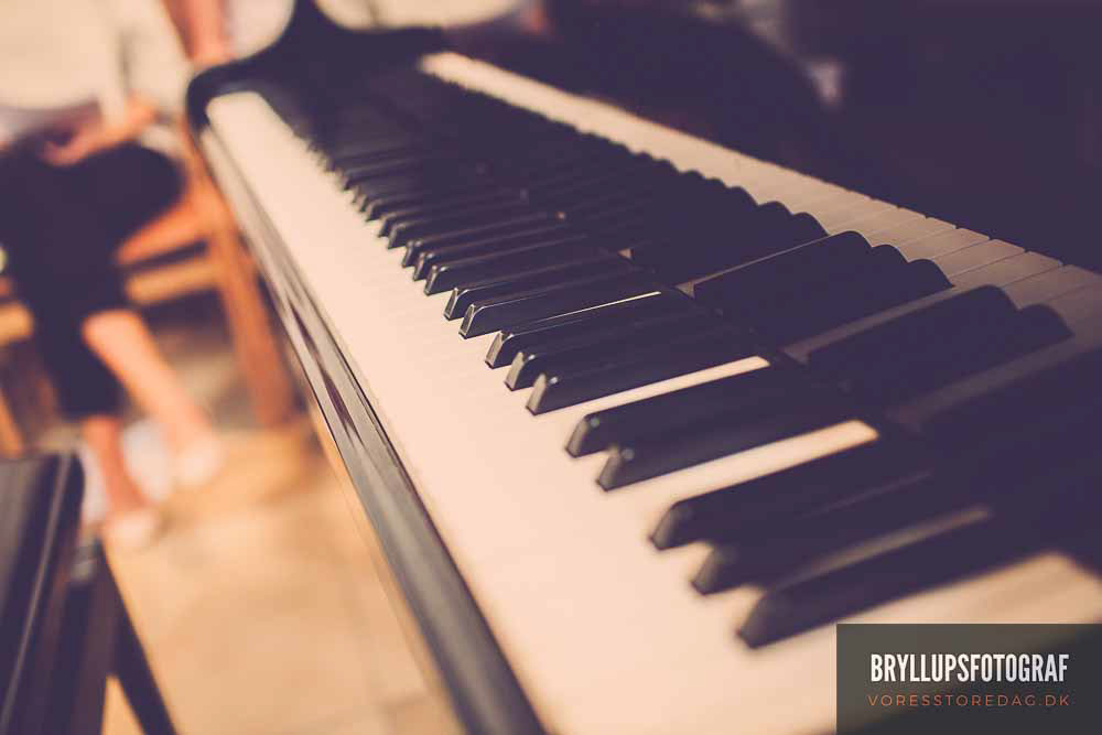 Image may contain: piano, music and musical keyboard