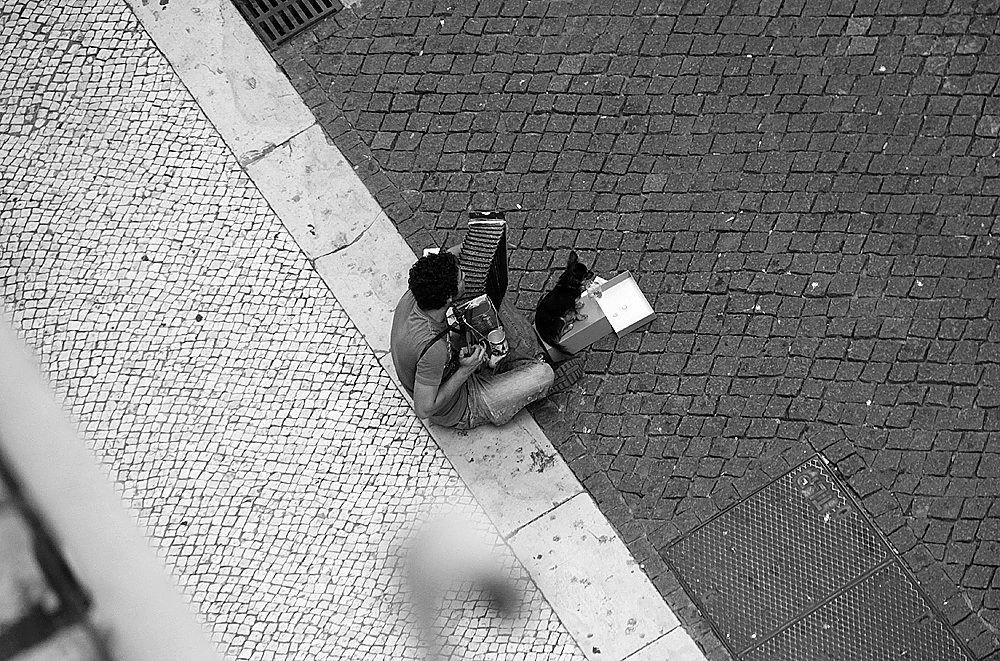 Rua do Carmo Lisbon Portugal street performers homeless anarchists Shops 5th floor view city
