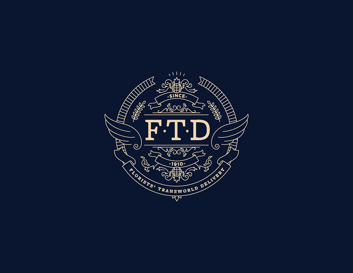 Rebrand Flowers seal logo FTD Florists Transworld Delivery dark blue gold and blue monoline logo wings brand book crest