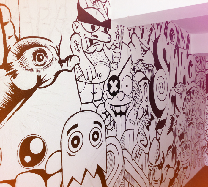 Mural art marcos Torres red black White grey spraypaint comics characters wall type Office indoor