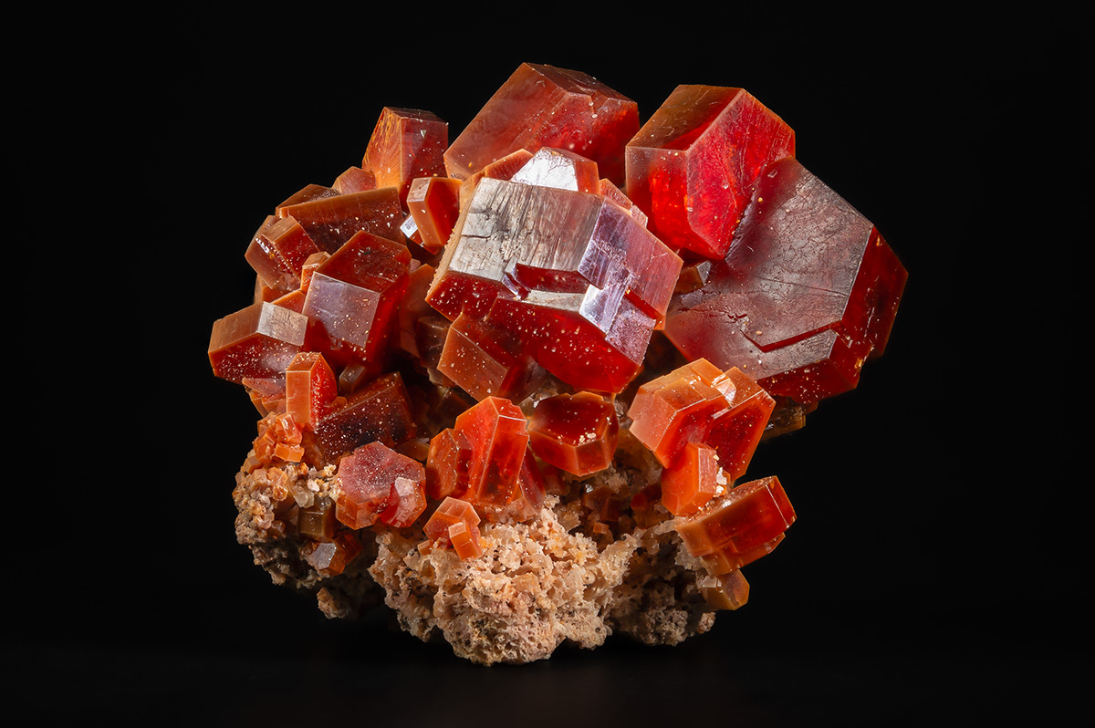 Bright red and orange Moroccan vanadinite on matrix mineral