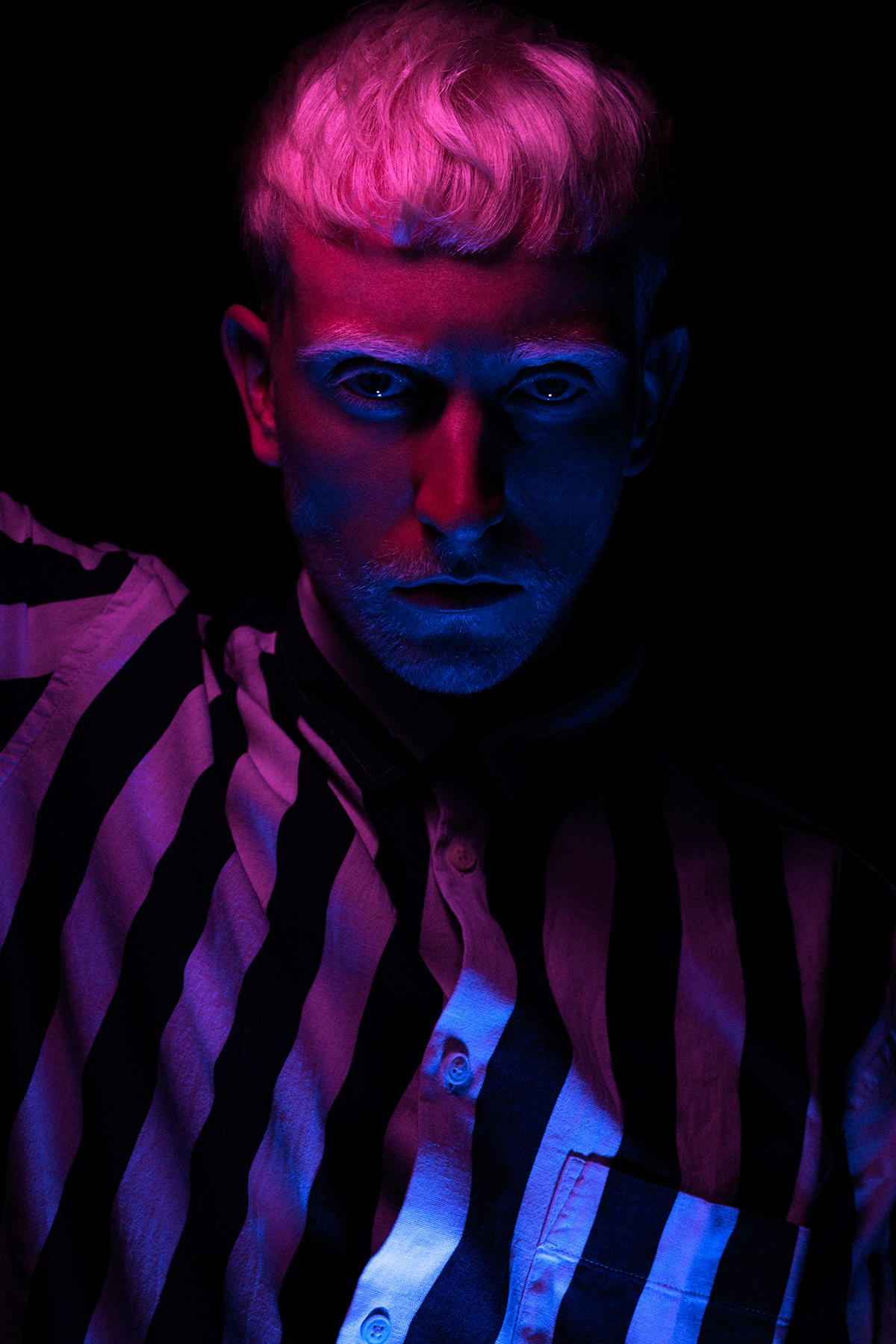 neon light portrait profoto B10 albino male model color gel
