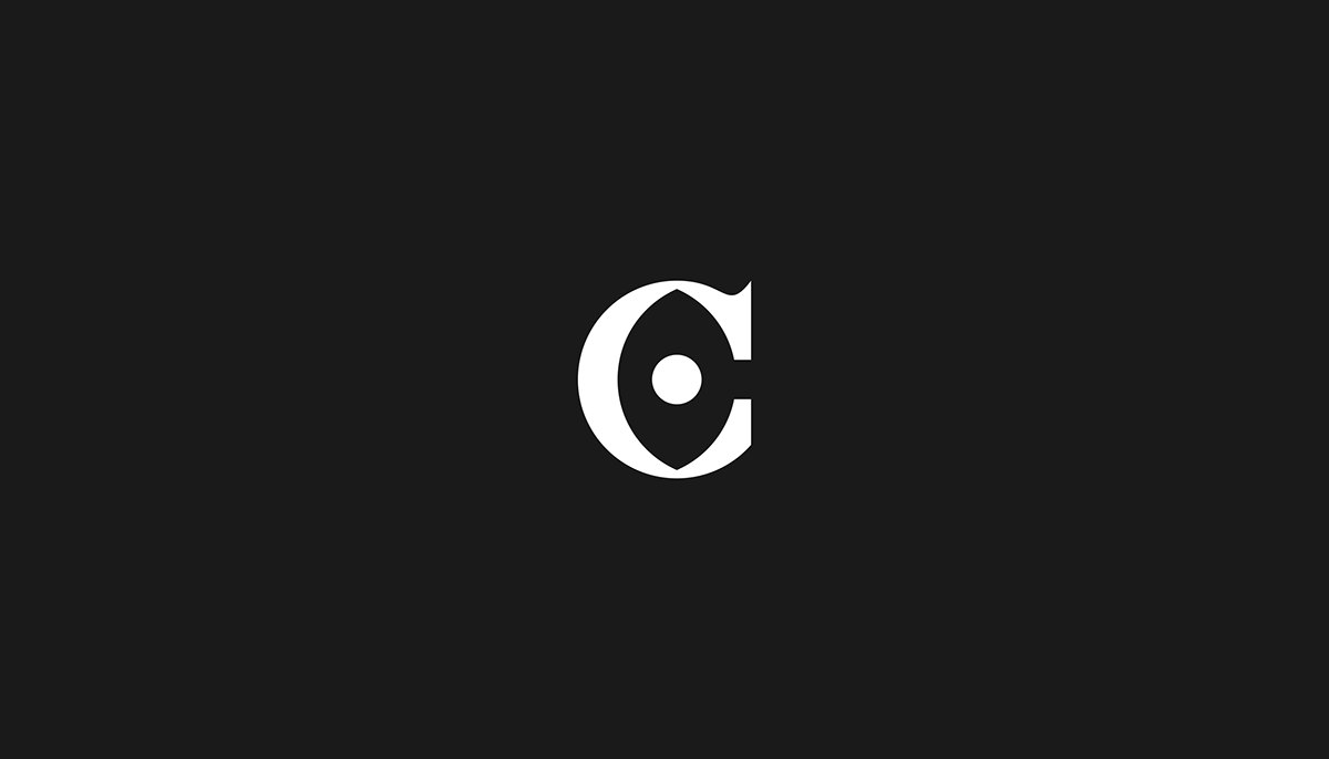 Serif capital 'C' with negative shape of human eye