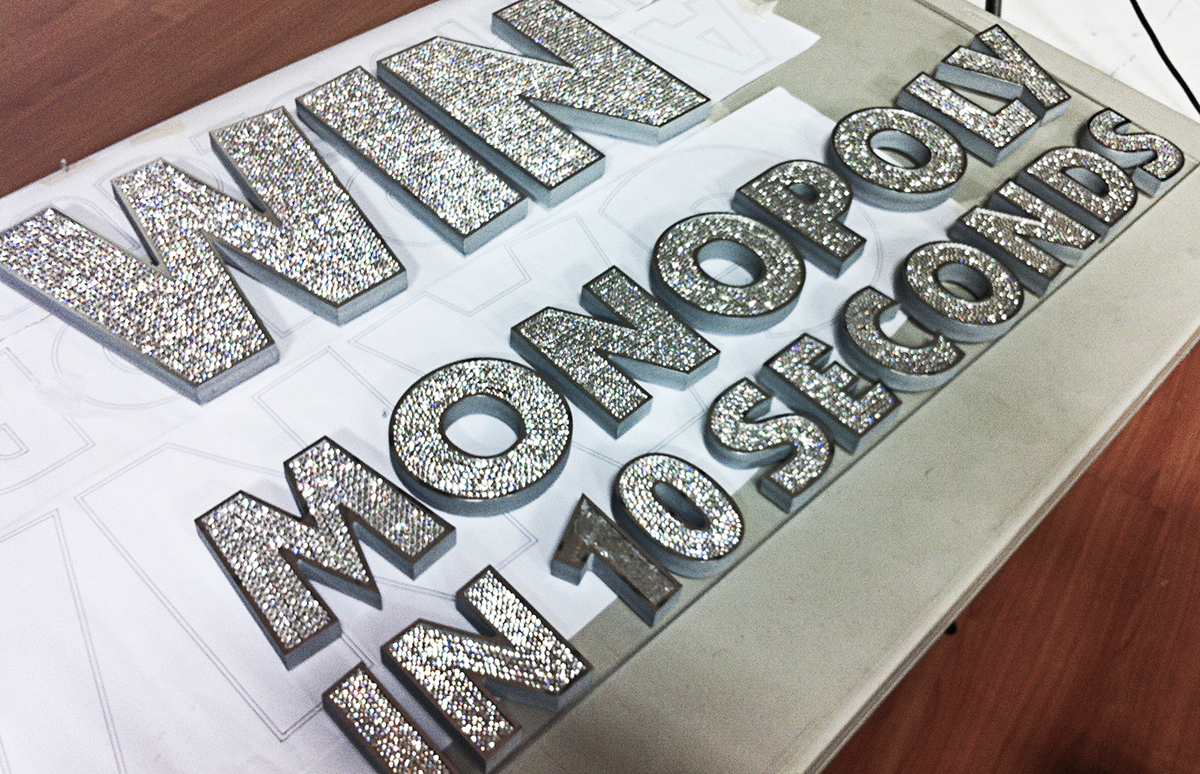 Swarovski  crystals type craft letters miami New York bling bling installation 3D laser money fortune Monopoly fast company