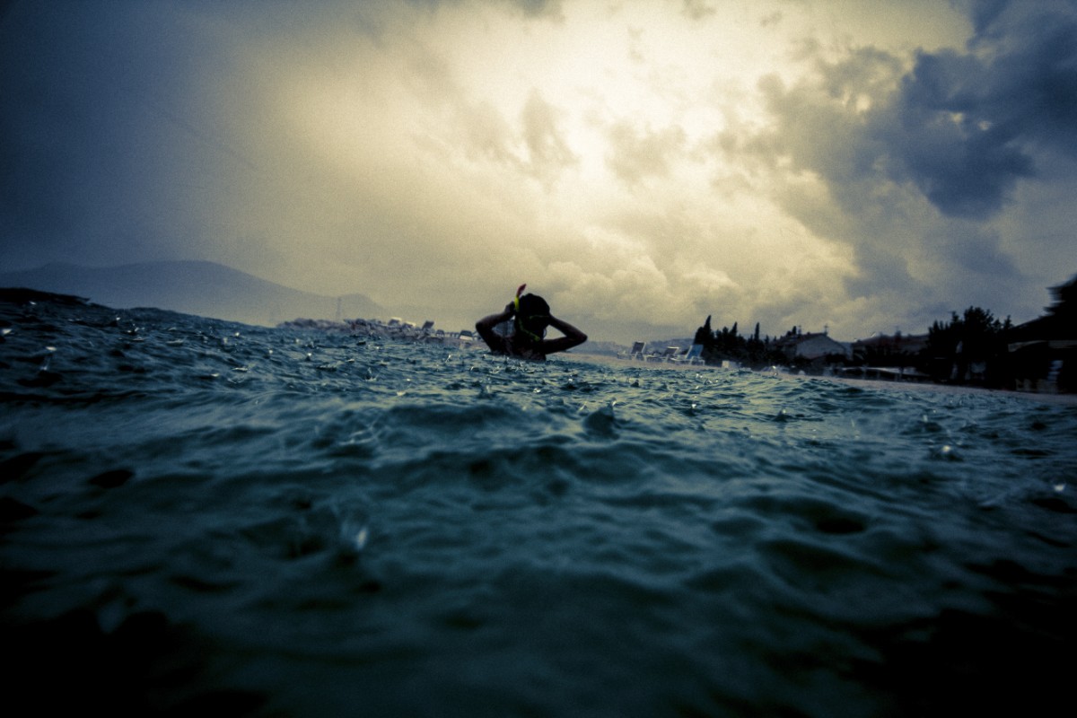 Croatia  Trogir  underwater Clive Newson  Photography  two tone beach sea rain swim water