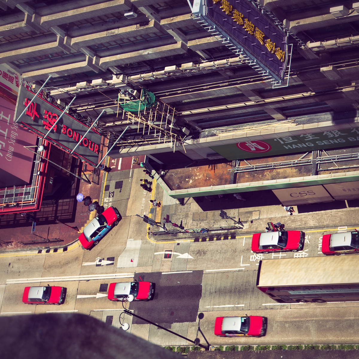 Elevated street view with red taxis. Hong Kong.