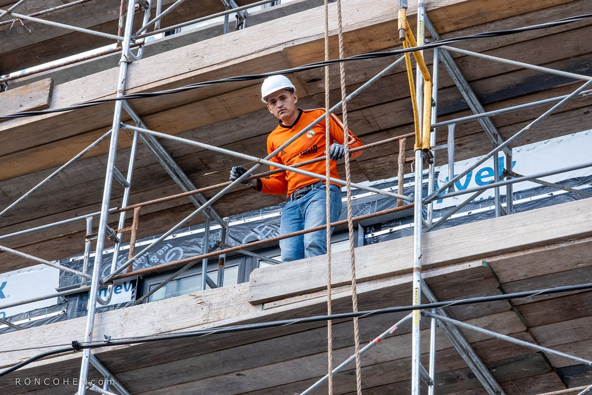apartment brick construction luxury Massachusetts scaffolding staging Waltham workman