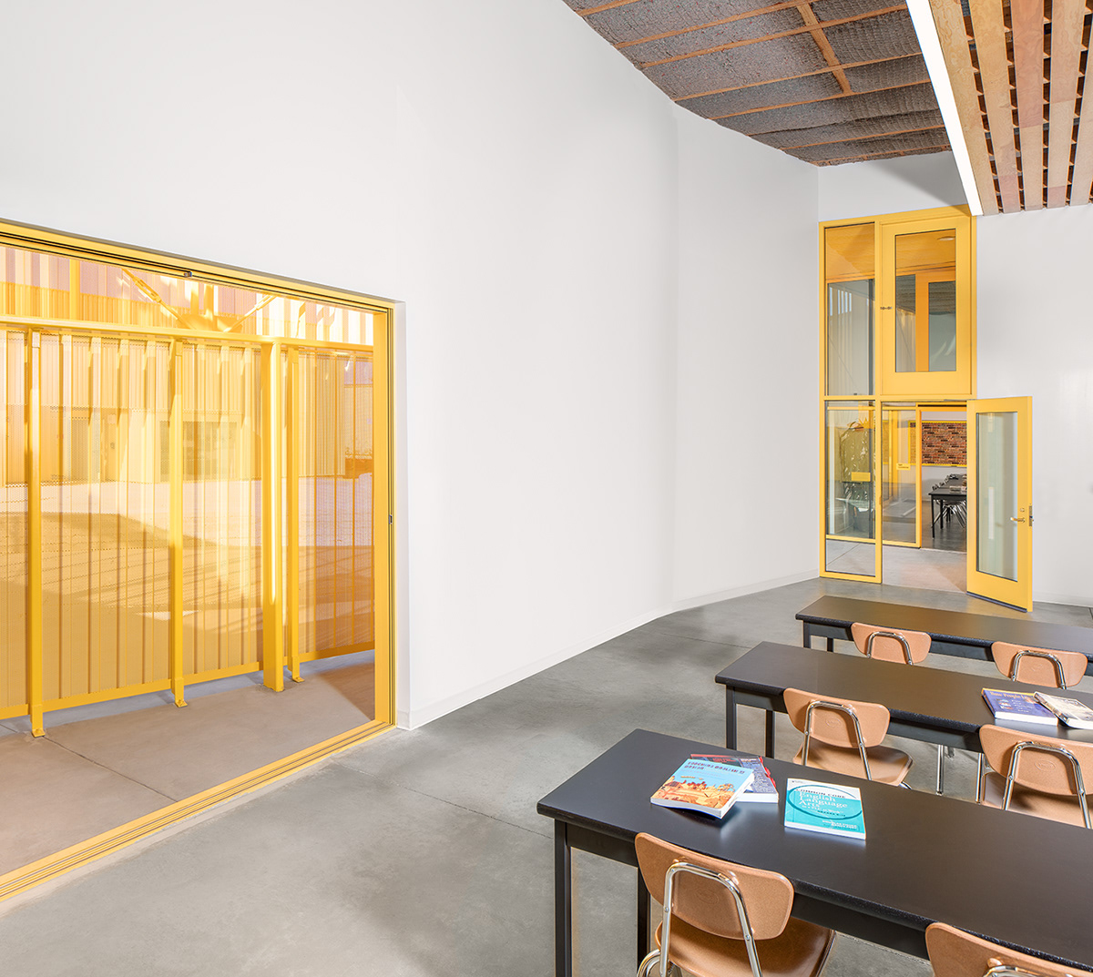 Adobe Portfolio animo south los charter high school Green Dot School lawrence scarpa perforated metal facade recycled concrete School Design Yellow school built around oil well modern school courtyard natural wool insulation perforated metal siding Yellow Building