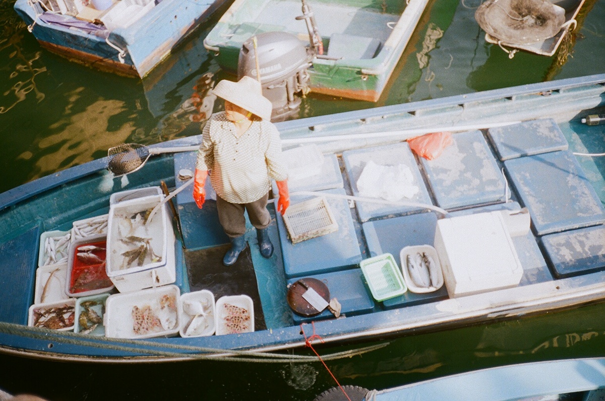 Fisherman woman sea Hong Kong asian fish seafood sell Sun life photo old