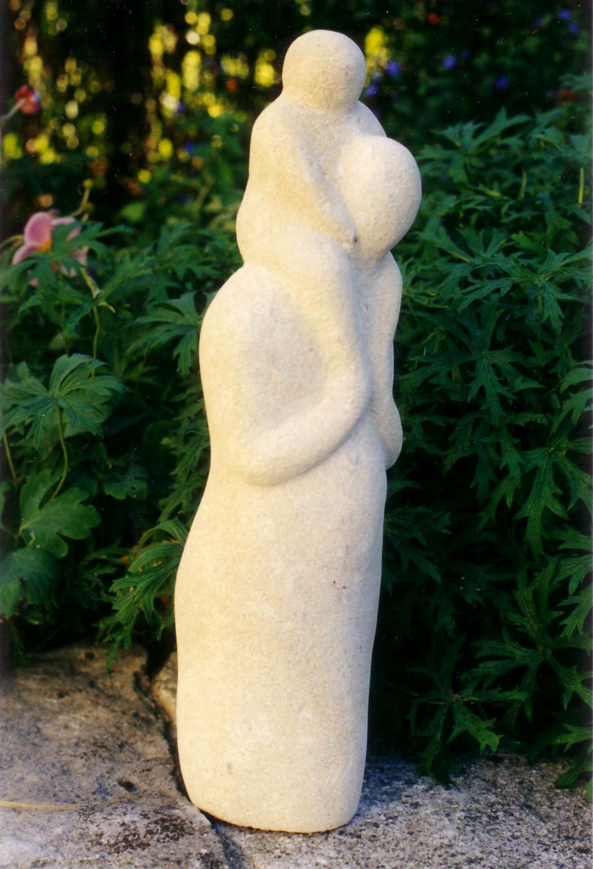 sculpture woman figure child children parent Carry family stone