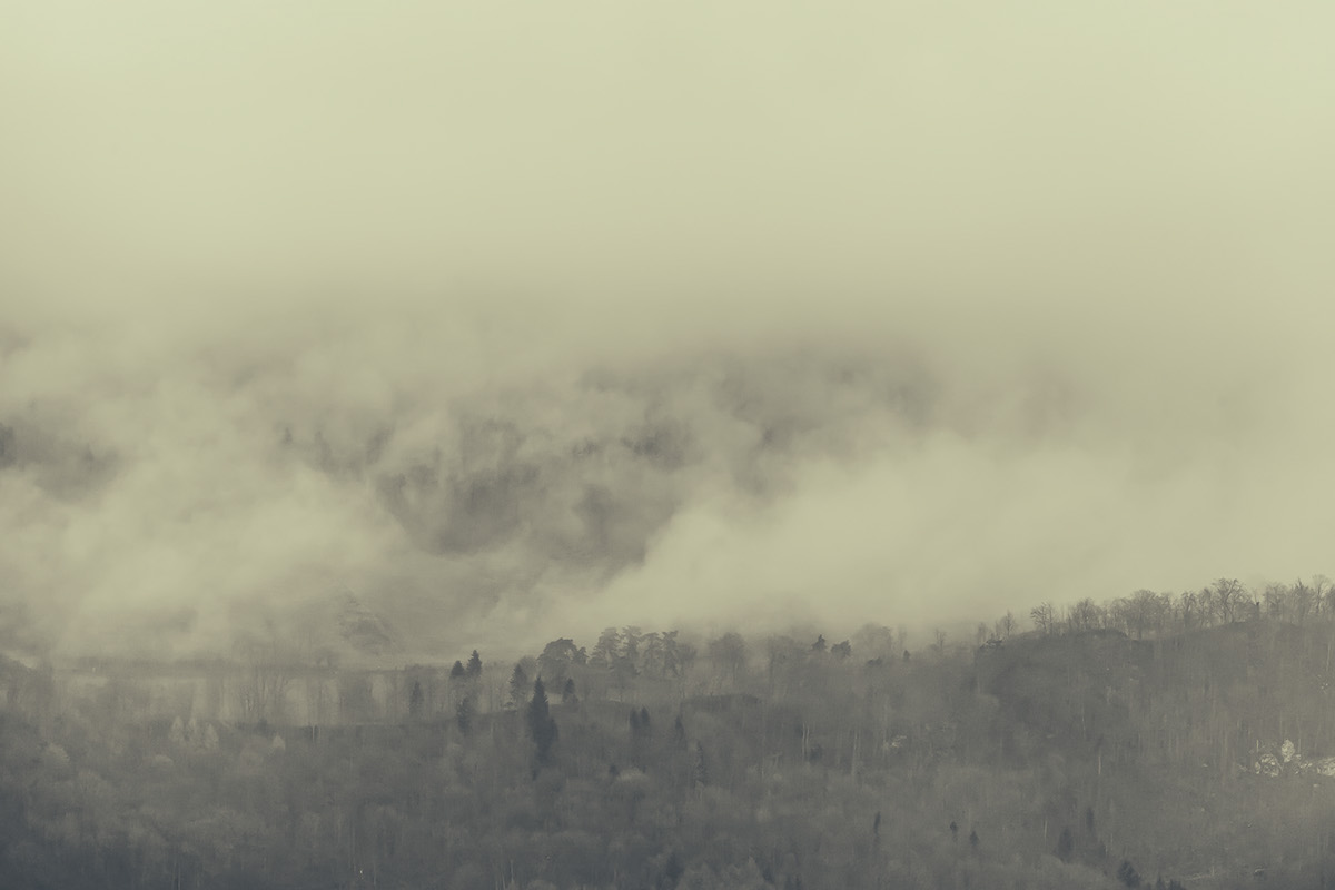 Landscape mountains fog mist clouds eerie Switzerland mysterious alien surreal