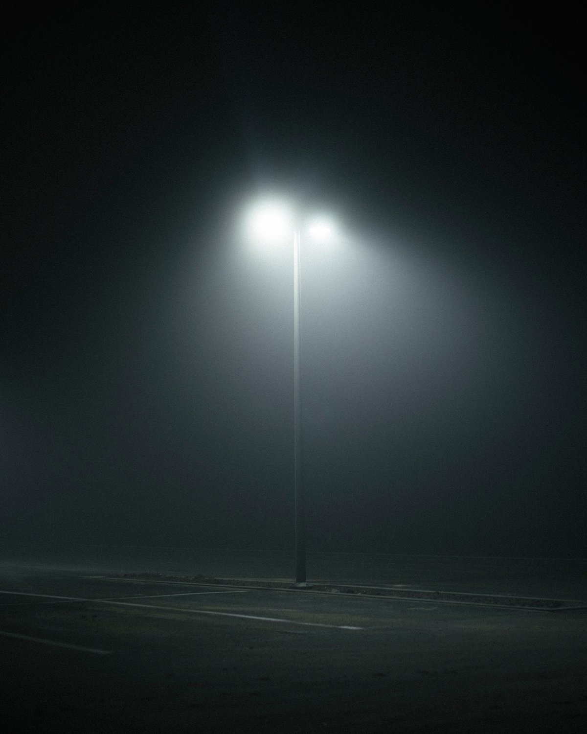 lost deserted desolate fog mist streets buildings light dark Cinema movie mood eerie abandoned