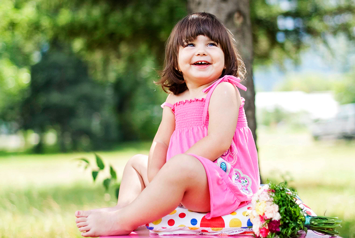 little girl smiles cute Outdoor Park child pure funny