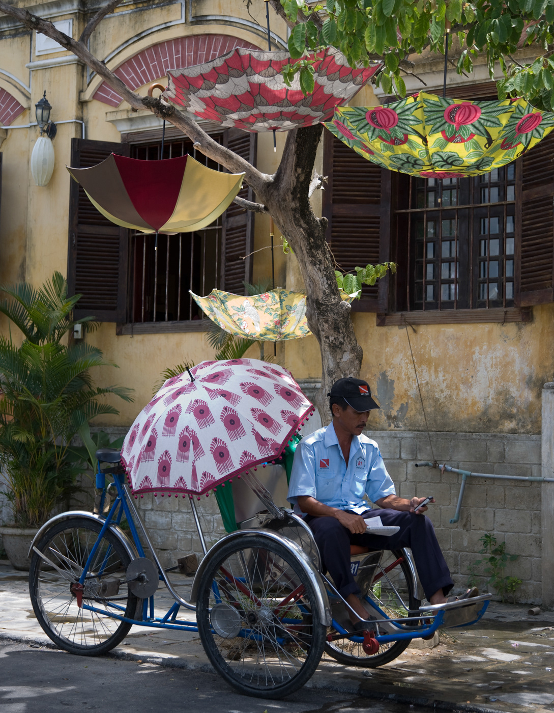 Textiles fabrics Parasols umbrellas vietnam colour canoes markets