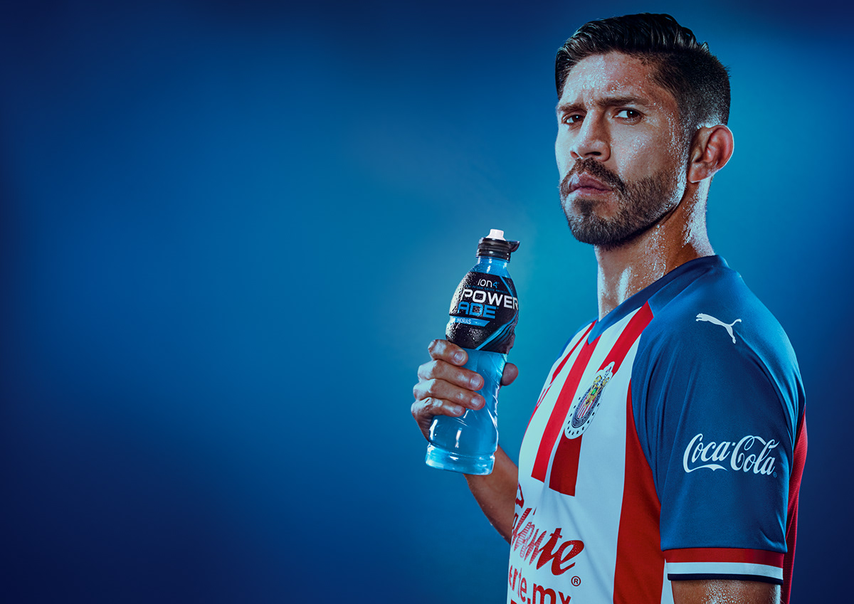 Portrait of Oribe Peralta, Mexico's soccer player stand with a bottle of Powerade in his hand