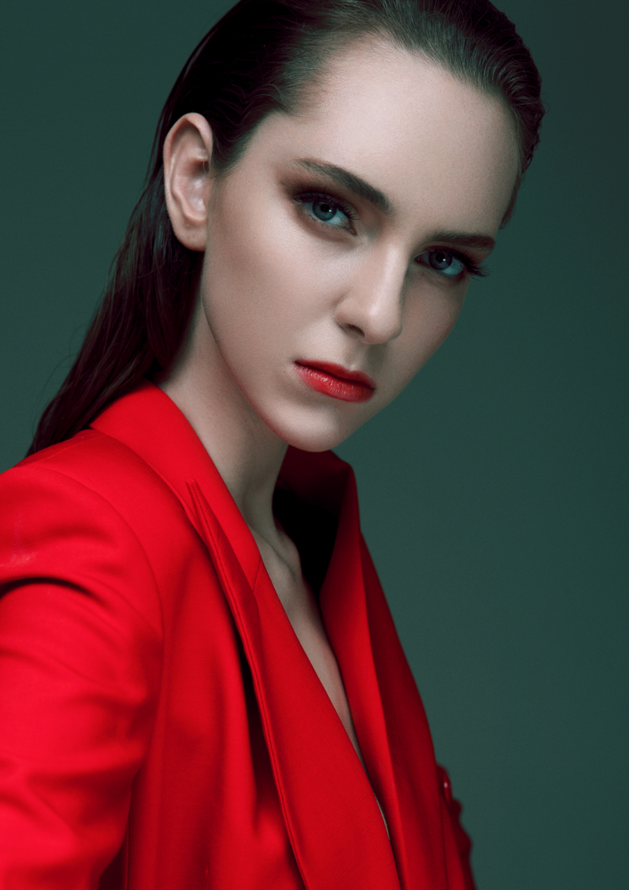 Style model girl gorgeous red coat designer beauty portrait wet hair studio